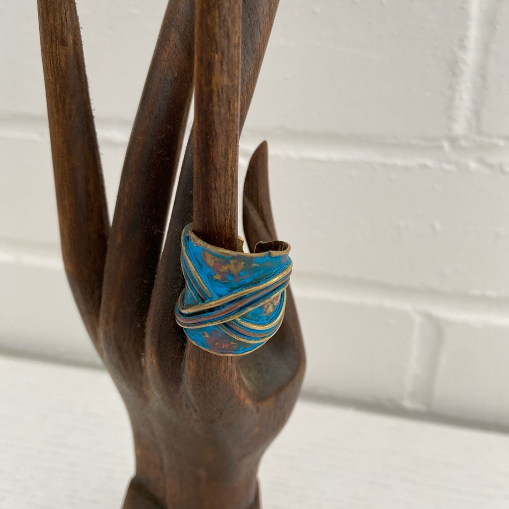Patina brushed gold-blue adjustable ring with cross-cross design on top